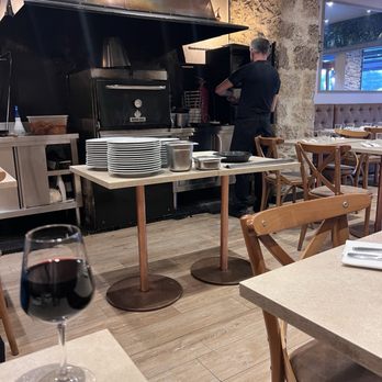 L'Antica - 5/13/26 FYI. Bordeaux and chef in background at work. - Provencal Near Me - Nice, 06
