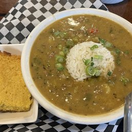 Bowl of crawfish etouffee with sweet cornbread Bowl of crawfish etouffee with sweet cornbread