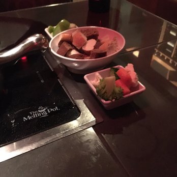The Melting Pot - Spinach artichoke fondue, the dippers. Green apple, different types of bread, broccoli, cauliflower, and carrots. - Fondue Near Me - Austin, Texas