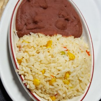 Abi's Restaurant - Beans and rice on the side of the fajitas. Note the pieces of corn and mild red peppers in the rice. - Mexican Near Me - Minneapolis, Minnesota Abi's Restaurant - Beans and rice on the side of the fajitas. Note the pieces of corn and mild red peppers in the rice. - Mexican Near Me - Minneapolis, Minnesota