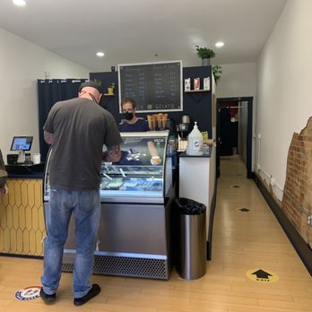 Golden Gelato - a man and a woman standing in front of a counter - Gelato Near Me - Covington, Kentucky Golden Gelato - a man and a woman standing in front of a counter - Gelato Near Me - Covington, Kentucky