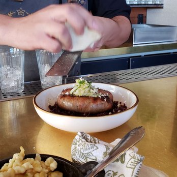 Von Bismarck - Bratwurst on a bed of cooked red cabbage, topped with green apple and grated horseradish. - German Near Me - Reno, Nevada