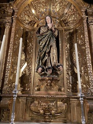 Photo of Cathedral de Sevilla - Seville, SE, ES. Creepy baby heads at the base of Mary