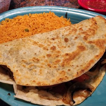Zapata's Mexican Kitchen - Chicken Fajita Quesadilla ( came with the side looking like someone tore a few bites off) - Mexican Near Me - Pickerington, Ohio Zapata's Mexican Kitchen - Chicken Fajita Quesadilla ( came with the side looking like someone tore a few bites off) - Mexican Near Me - Pickerington, Ohio
