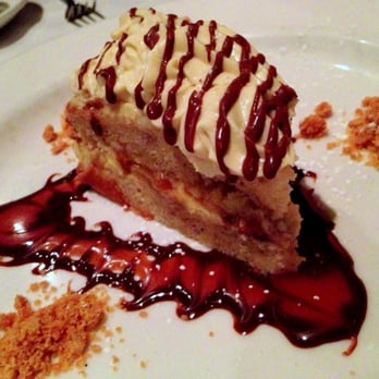 The Brewer's Art - Banana Cake (Banana Pound Cake, Pastry Cream, Bananas, Crushed Peanut Butter Brittle, Drizzled with Chocolate Ganache) - Breweries Near Me - Baltimore, Maryland The Brewer's Art - Banana Cake (Banana Pound Cake, Pastry Cream, Bananas, Crushed Peanut Butter Brittle, Drizzled with Chocolate Ganache) - Breweries Near Me - Baltimore, Maryland