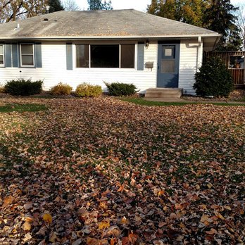 Rettmann Outdoor Services - a house in the fall - Snow Removal Near Me