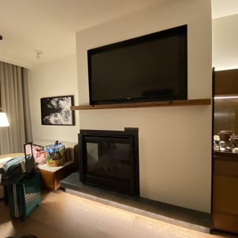 The Cloudveil, Autograph Collection - Small sitting area with fireplace and Nespresso coffee service in room - Hotels Near Me - Jackson, Wyoming