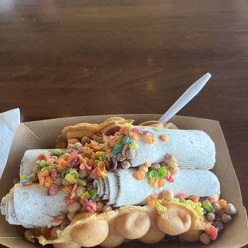 Roll & Bowl - An ice cream taco roll. Consists of Oreo flavored rolls, bubble waffle, and Reese's puffs & fruity pebbles as toppings - Comfort Food Near Me - Alameda, California