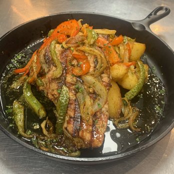 MP Kitchen and Bar - Pork Chop dinner with roasted potatoes and sautéed peppers and onions. - American Near Me - Wheeling, Illinois