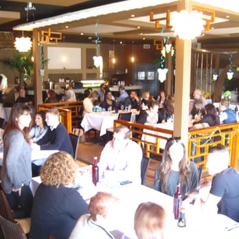 Akita - a large group of people sitting at tables in a restaurant - Japanese Near Me - Montreal, Quebec Akita - a large group of people sitting at tables in a restaurant - Japanese Near Me - Montreal, Quebec