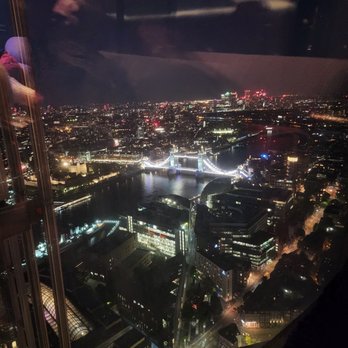 GŎNG - Night view from pool area. This table seats 5-6. - Cocktail Bars Near Me - London, XGL GŎNG - Night view from pool area. This table seats 5-6. - Cocktail Bars Near Me - London, XGL