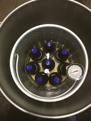 Photo of Chatter Creek Winery - Woodinville, WA, US. Sealing the bottles of cider.