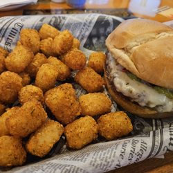 The Babylon Bar and Grill - Cajun Guac Burger with tots