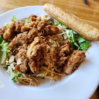 Applebee's Grill + Bar - The Oriental chicken salad with oversized breadstick at Applebee's in Riverhead, NY - American Near Me - Riverhead, New York Applebee's Grill + Bar - The Oriental chicken salad with oversized breadstick at Applebee's in Riverhead, NY - American Near Me - Riverhead, New York