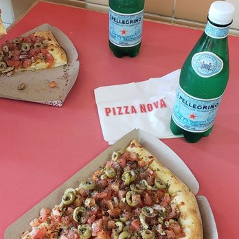 Pizza Nova - a slice of pizza and a bottle of soda - Pizza Near Me - Mississauga, Ontario Pizza Nova - a slice of pizza and a bottle of soda - Pizza Near Me - Mississauga, Ontario