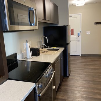 Townplace Suites By Marriott - Kitchen in 1 bedroom suite - Hotels Near Me - Janesville, Wisconsin