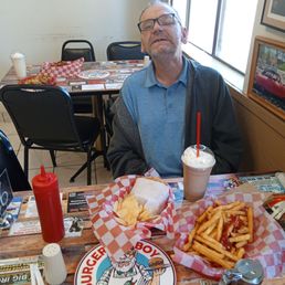 This is my brother he enjoyed his french fries, cheeseburger and chips as well as a chocolate milkshake :-) This is my brother he enjoyed his french fries, cheeseburger and chips as well as a chocolate milkshake :-)