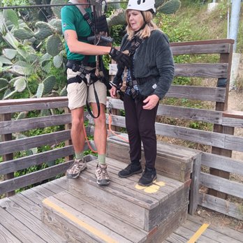 Catalina Eco Zip Line Tours - Danny helping with super safety. 1, 2, 3, 4, 5, 6, 7, all in place. Safety check each time. So thoural. - Tours Near Me - Avalon, California Catalina Eco Zip Line Tours - Danny helping with super safety. 1, 2, 3, 4, 5, 6, 7, all in place. Safety check each time. So thoural. - Tours Near Me - Avalon, California