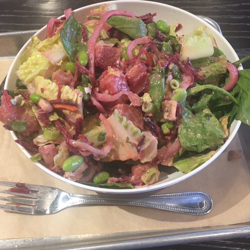BYO Salad with tuna, edamame, pickled onions, mushrooms, scallions and beets on a bed of romaine and spinach with Thai cashew dressing.