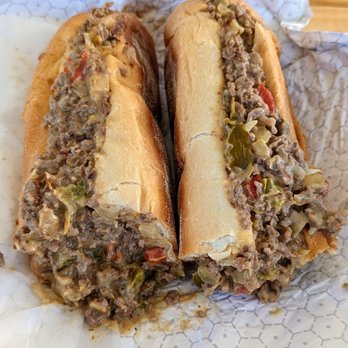 Phila Deli - Large cheese steak with onions, cherry peppers, and extra cheese. - Delis Near Me - Tierra Verde, Florida Phila Deli - Large cheese steak with onions, cherry peppers, and extra cheese. - Delis Near Me - Tierra Verde, Florida