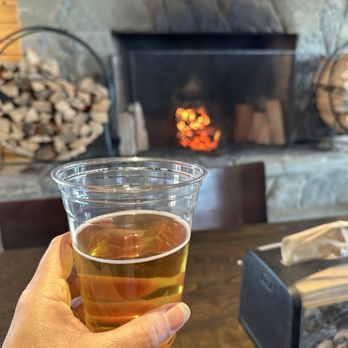 Duck Point Smokehouse Restaurant - Enjoying a beer by the fire - Smokehouse Near Me - Hoonah, Alaska
