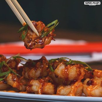 State & Main Kitchen & Bar - a plate of food with chopsticks - Bars Near Me - Airdrie, Alberta State & Main Kitchen & Bar - a plate of food with chopsticks - Bars Near Me - Airdrie, Alberta