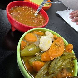 Pickled jalapeños and carrots and salsas.