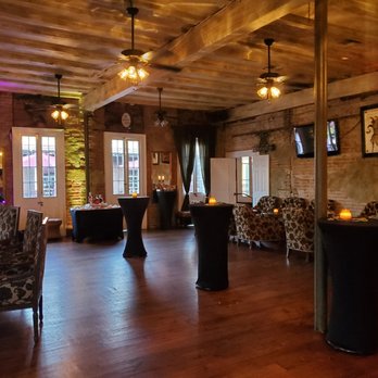 Maison Bourbon - a large room with a piano and tables - Jazz & Blues Near Me - New Orleans, Louisiana