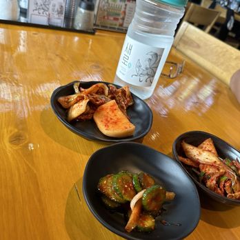 Mr. Tang - Side dishes:  cucumbers, fresh kimchi and picked (?) - Korean Near Me - Aurora, Colorado