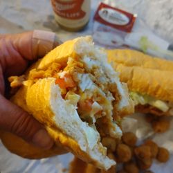 Cajun Persuasion Seafood Market & Poboys - Fried catfish po' boy fully dressed