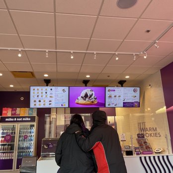 Insomnia Cookies - two people standing in front of a counter - Desserts Near Me - Dekalb, Illinois