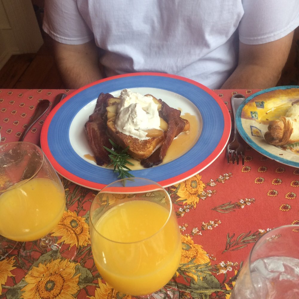 French toast with apples, maple syrup and bacon. French toast with apples, maple syrup and bacon.