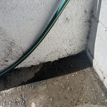 City Plumbing and Rooter - Testing shows water pooling and intruding into the gap that remains because asphalt not removed and concrete slope not installed. - Plumbing Near Me - Winnetka, California City Plumbing and Rooter - Testing shows water pooling and intruding into the gap that remains because asphalt not removed and concrete slope not installed. - Plumbing Near Me - Winnetka, California