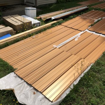 Northern Michigan Services - Roofing supplies sitting in our front yard for every car driving by to see. - Roofing Near Me - Alba, Michigan