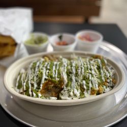 Tikka Bowls and Tacos - Tika bowl half chicken half steak with cilantro, rice, smoky curry sauce