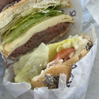Ridge Country Deli - a hand holding a sandwich - Delis Near Me - Ridge, New York Ridge Country Deli - a hand holding a sandwich - Delis Near Me - Ridge, New York