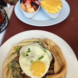 Spinach bacon crepe, side of fruit and cheesy grits (select your own cheese)