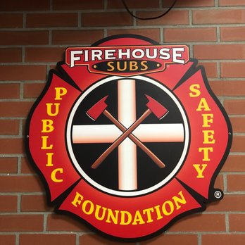 Firehouse Subs - a fire department logo on a brick wall - Fast Food Near Me - Riverview, Florida