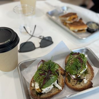 Ananas Coffee - AVOCADO TOAST - ACME sourdough toasted topped with avocado smash, fresh lemon juice, micro greens, cucumber, radish, olive oil drizzle - Coffee & Tea Near Me - Walnut Creek, California Ananas Coffee - AVOCADO TOAST - ACME sourdough toasted topped with avocado smash, fresh lemon juice, micro greens, cucumber, radish, olive oil drizzle - Coffee & Tea Near Me - Walnut Creek, California