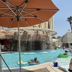 MGM Grand Pool Complex - Waterfall at MGM grand pool, lazy river in back ground!  Taken from our rented day bed
