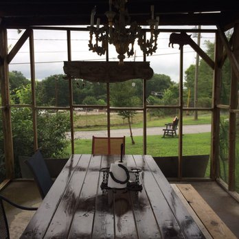 Iron Pig BBQ - a wooden table and chairs - Barbeque Near Me - Jefferson, Georgia