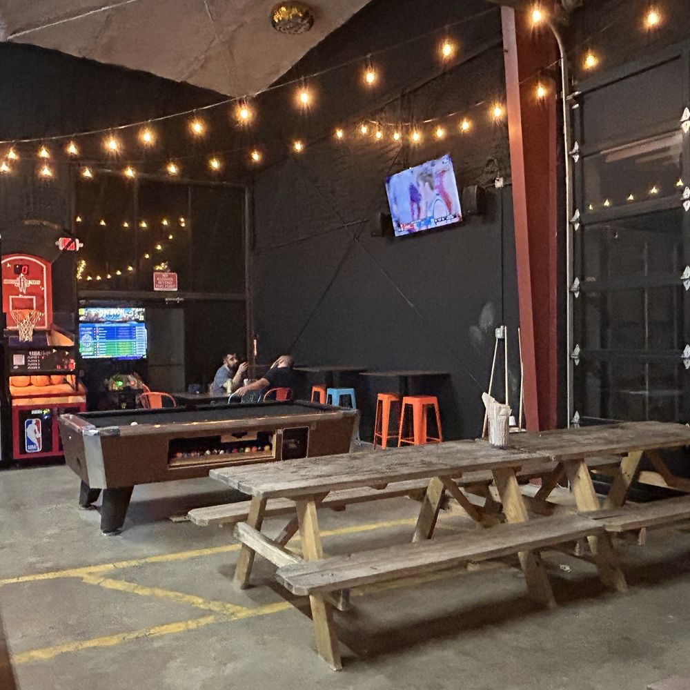 Ants Beer Cave - Indoor area with basketball game and TV - Beer Bar Near Me - Austin, Texas