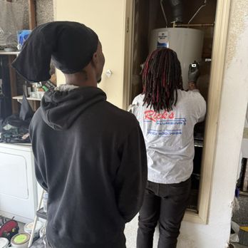 Rick's Plumbing - Working hard to put the water heater in correctly - Plumbing Near Me Rick's Plumbing - Working hard to put the water heater in correctly - Plumbing Near Me