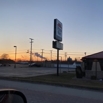 Pizza Hut - the outside sunset, with the sign. - Pizza Near Me - Caro, Michigan Pizza Hut - the outside sunset, with the sign. - Pizza Near Me - Caro, Michigan
