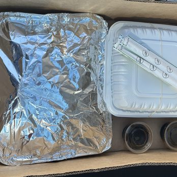 Dong Yang Inn - This is how they packed the small party pan of meat jun on left and 2 side orders of chopchae on right. - Korean Near Me - Wahiawa, Hawaii