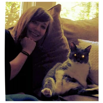 Ruff Mutts - Heather, one of our caring dog walkers & pet sitters, taking a moment for a silly pose with her own laser eye kitty! - Dog Walkers Near Me - Portland, Oregon