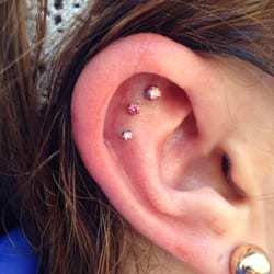 Triple flat piercing created by Joey Johnson featuring only the finest jewelry from NeoMetal.