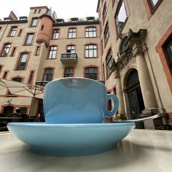Father Carpenter Coffee Brewers - A cortado in the courtyard seating - Coffee & Tea Near Me - Berlin, BE Father Carpenter Coffee Brewers - A cortado in the courtyard seating - Coffee & Tea Near Me - Berlin, BE
