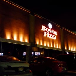 the outside of a restaurant at night