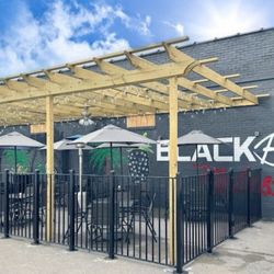 Blackberry Molasses - Outdoor dining area on side of building